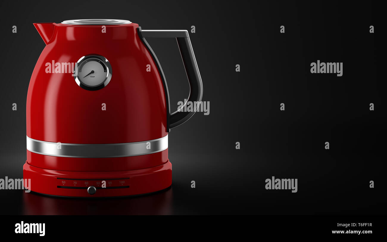 red electric kettle on black background with copyspace Stock Photo