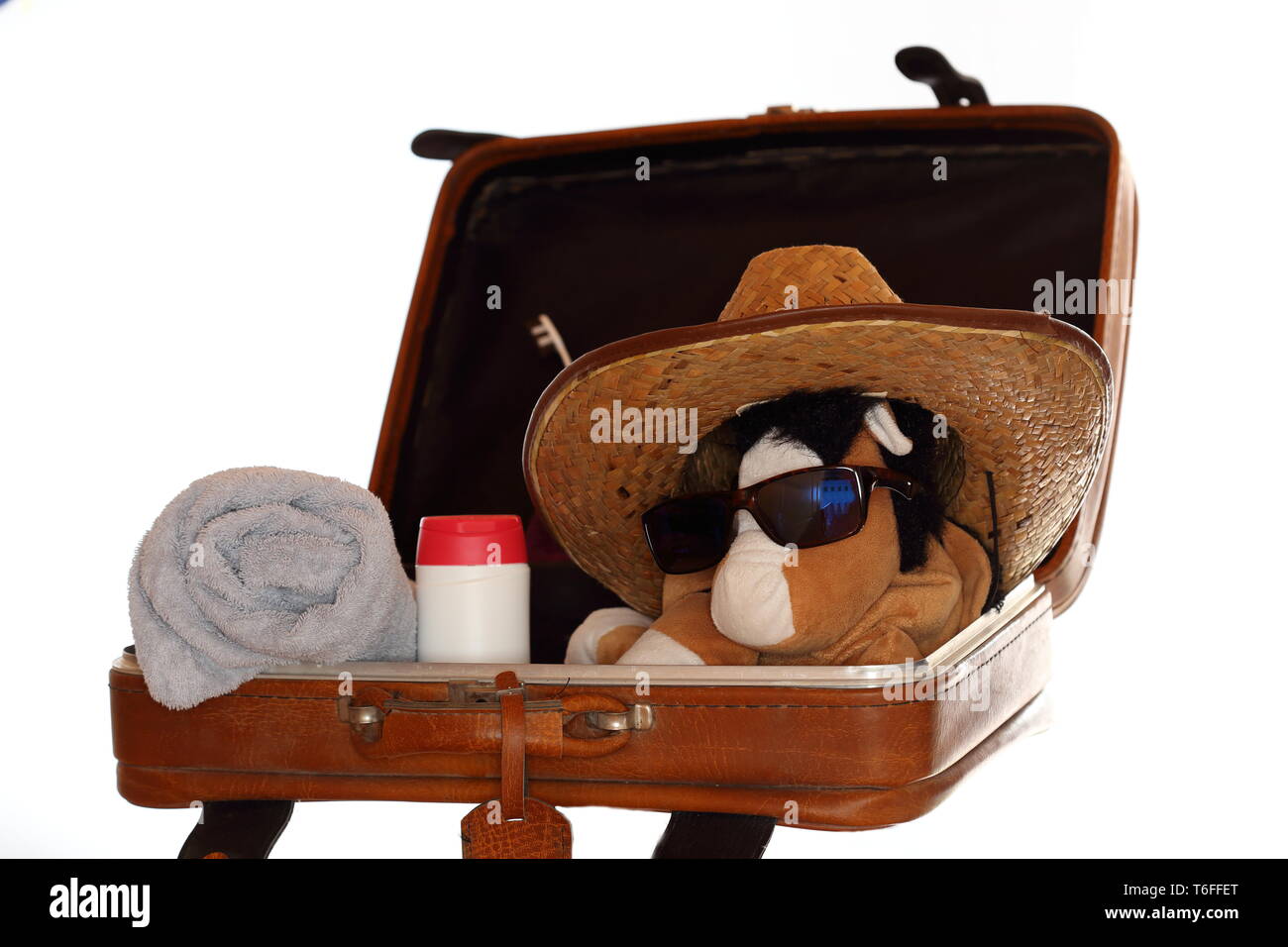 opened bag with soft toy and towel Stock Photo