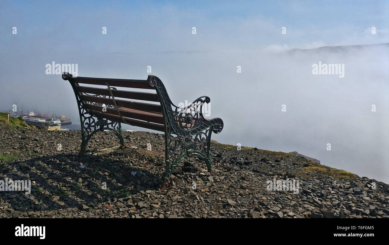 bench above the clouds Stock Photo