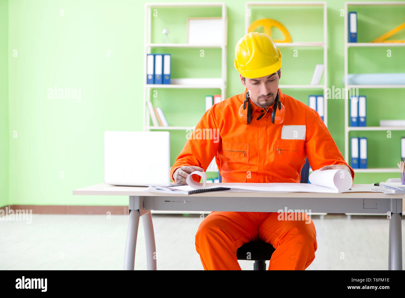 Construction supervisor planning new project in office Stock Photo - Alamy