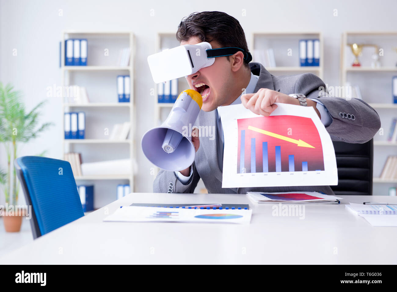 Businessman with virtual reality glasses in the office Stock Photo - Alamy