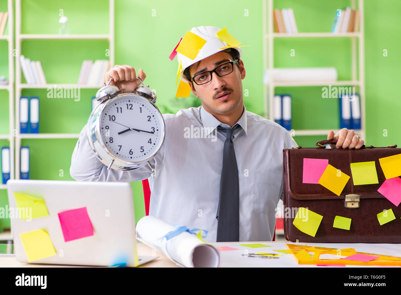 Male engineer working on new project with many conflicting prior Stock ...