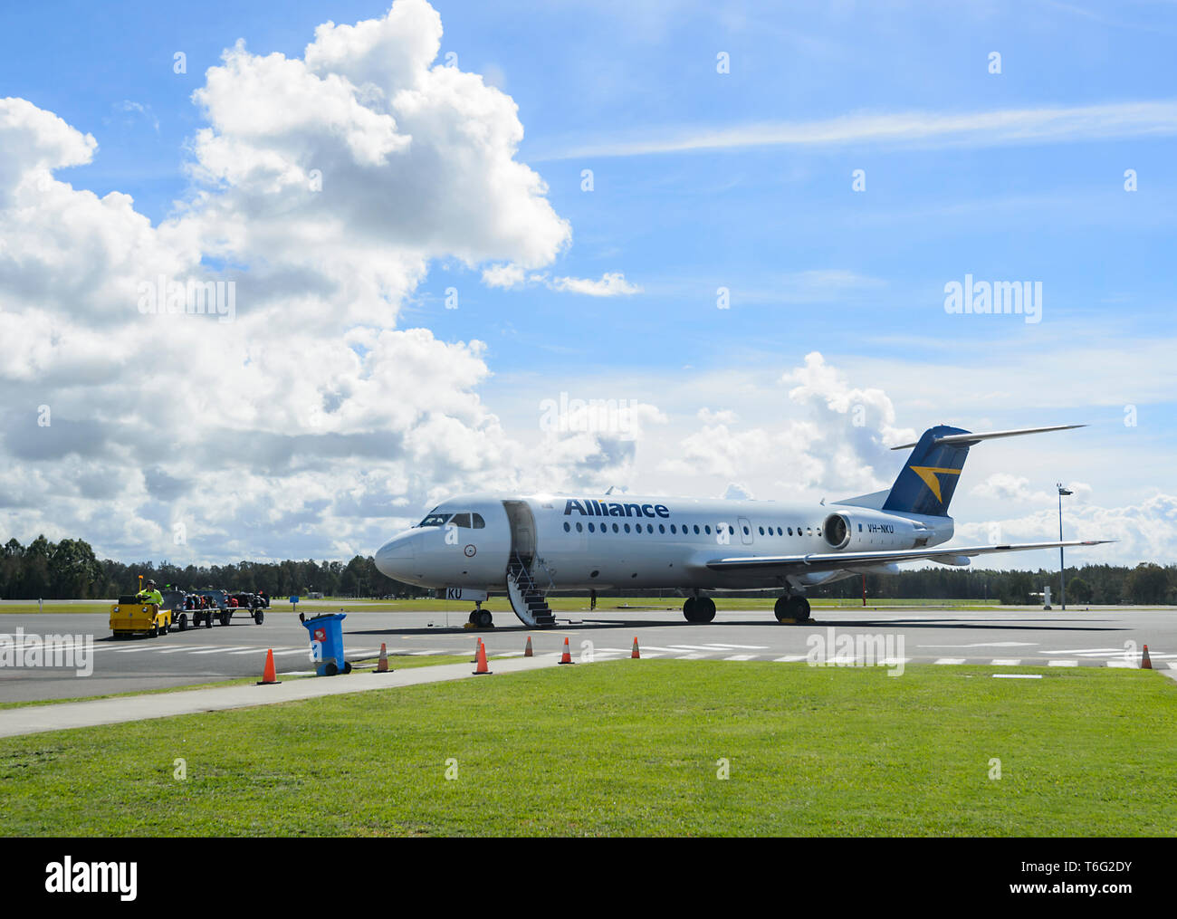 Alliance Airlines VH-NKU Fokker 70 Aircraft on the apron at Brisbane Airport, domestic terminal, Queensland, QLD, Australia Stock Photo