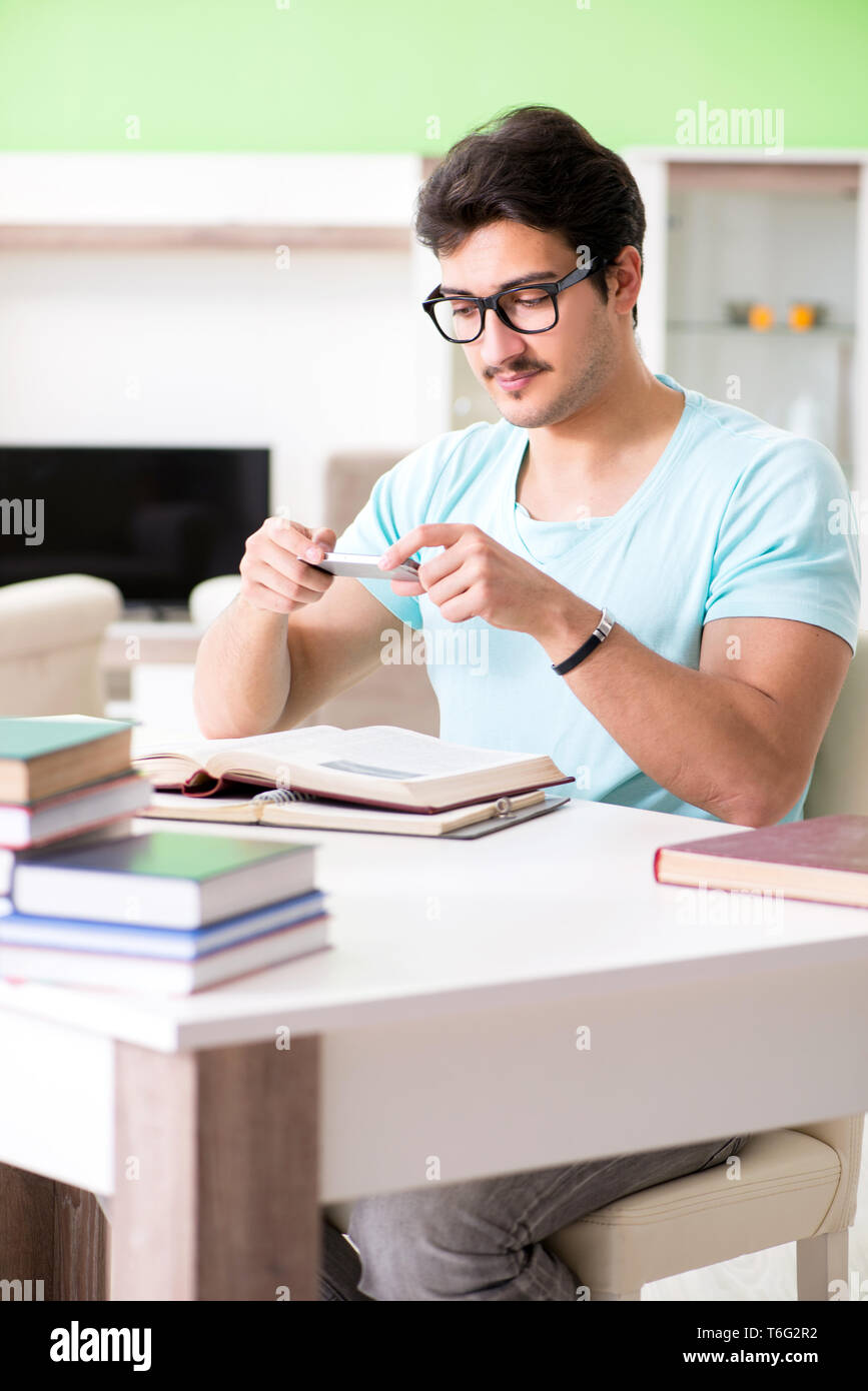 Student preparing for university exams at home Stock Photo - Alamy