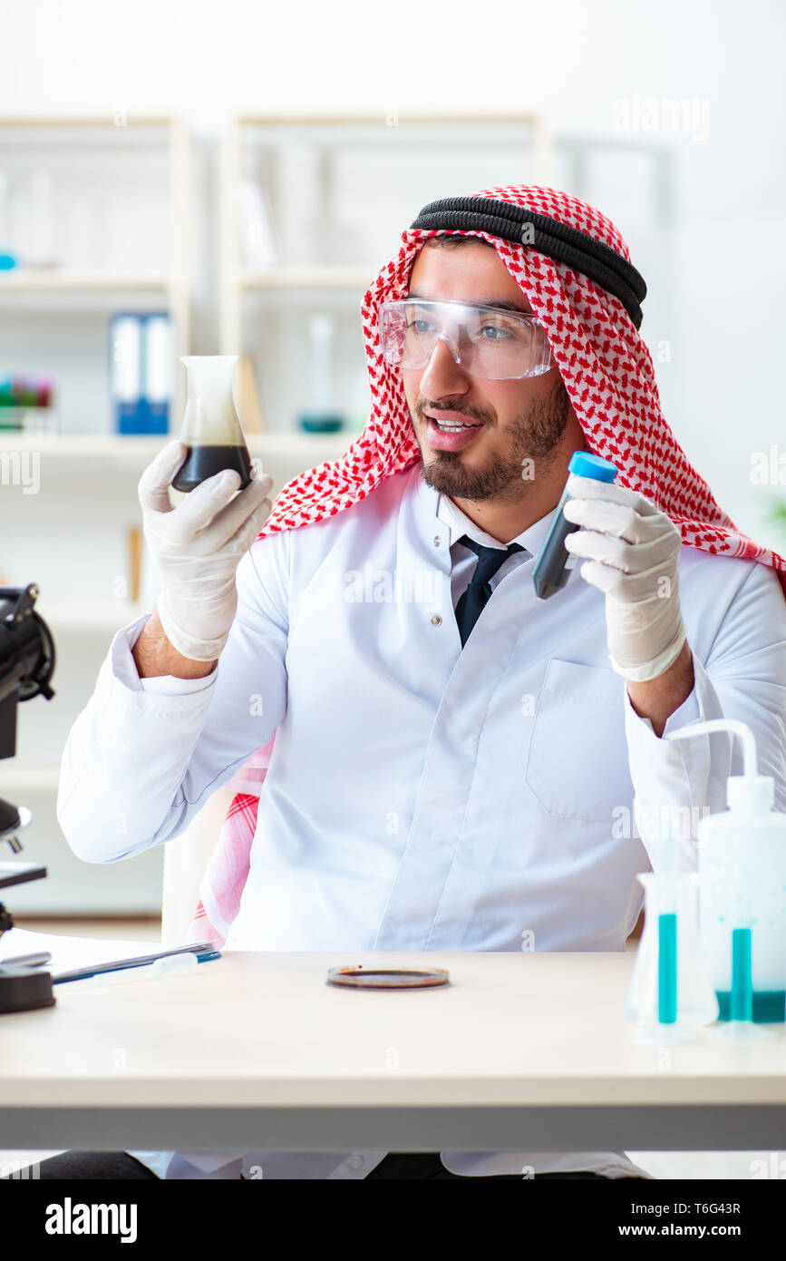 Arab chemist scientist testing quality of oil petrol Stock Photo