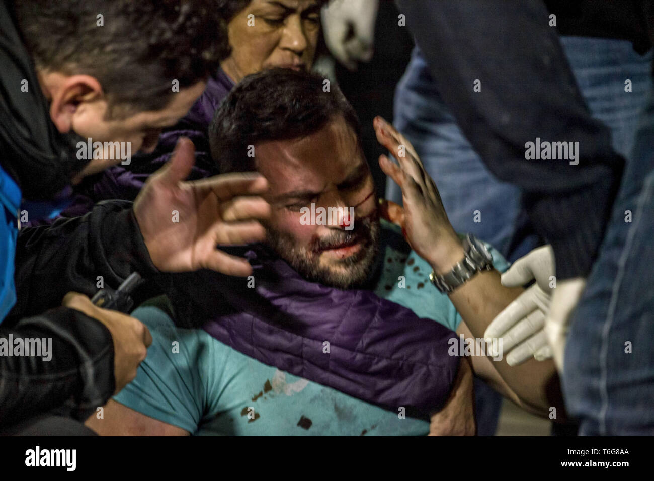 Buenos Aires, Federal Capital, Argentina. 30th Apr, 2019. A protester, sympathizer, of the Venezuelan government of  Maduro, protested in front of the Venezuelan Embassy in Buenos Aires his repudiation against the Civic Military uprising that was taking place in Venezuela, led by the leaders of the Venezuelan opposition, Juan GuaidÃ³ and Leopoldo Lopez, and was strongly repressed by members of the Argentine Federal Police after a slight altercation arose between demonstrators who supported Juan Guaido and Leopoldo against those who supported  Maduro. Credit: ZUMA Press, Inc./Alamy Live News Stock Photo