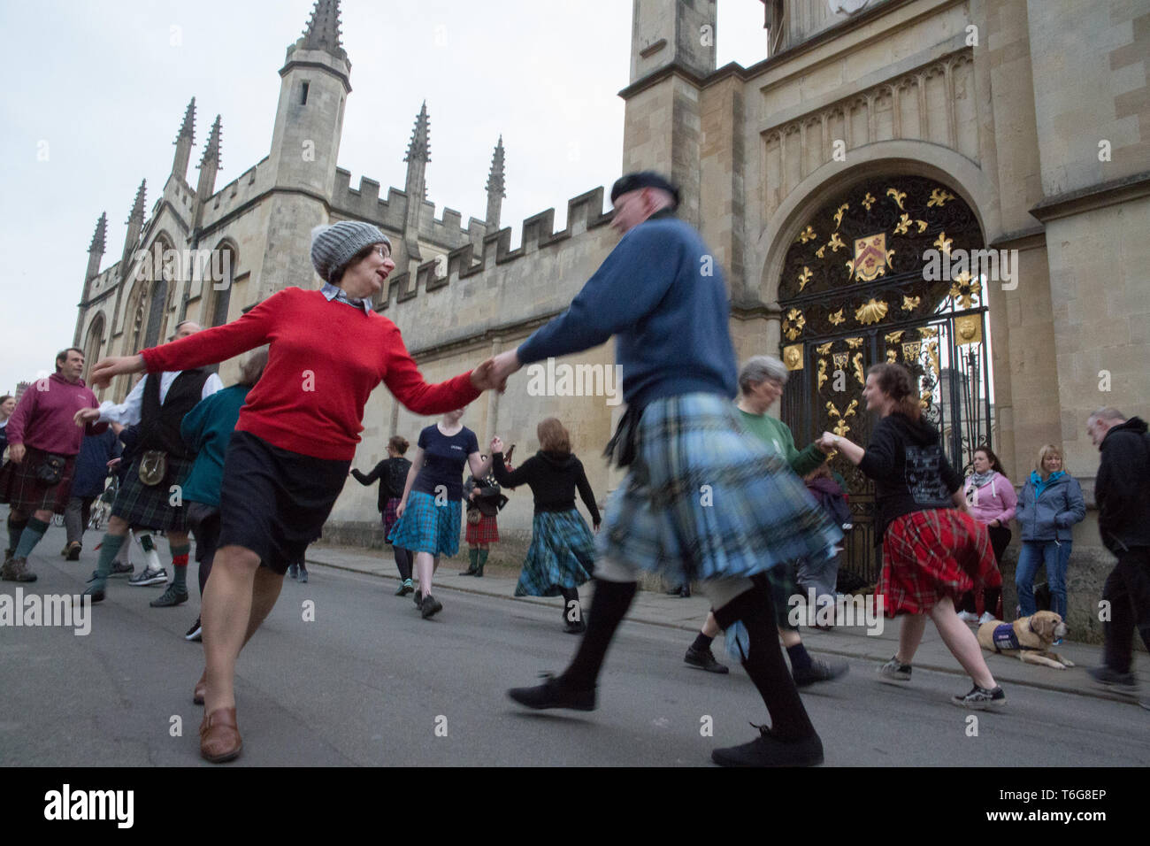 Oxford, UK. 1st May, 2019. Crowds of people gathered on Magdalene bridge to  hear a choir singing atop the Magdalene College Tower for a yearlong  tradition during Mayday celebration. Dancing in the