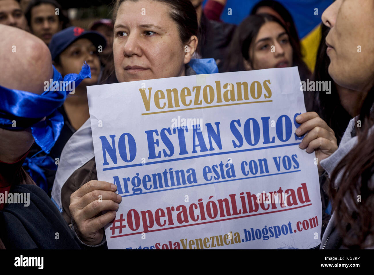 April 30, 2019 - Buenos Aires, Federal Capital, Argentina - This Tuesday, April 30, Venezuelan migrants residing in the city of Buenos Aires moved to the Venezuelan Embassy in the Capital City to express their support for the leaders of the Venezuelan opposition, Juan GuaidÃ³ and Leopoldo Lopez, at the same time they made strong confrontations in the Venezuelan capital. The Venezuelan Embassy in La Ciudad PorteÃ±a also presented leftist organizations and sympathizers of Nicolas Maduro who repudiated the events that took place in Venezuela. Credit: ZUMA Press, Inc./Alamy Live News Stock Photo