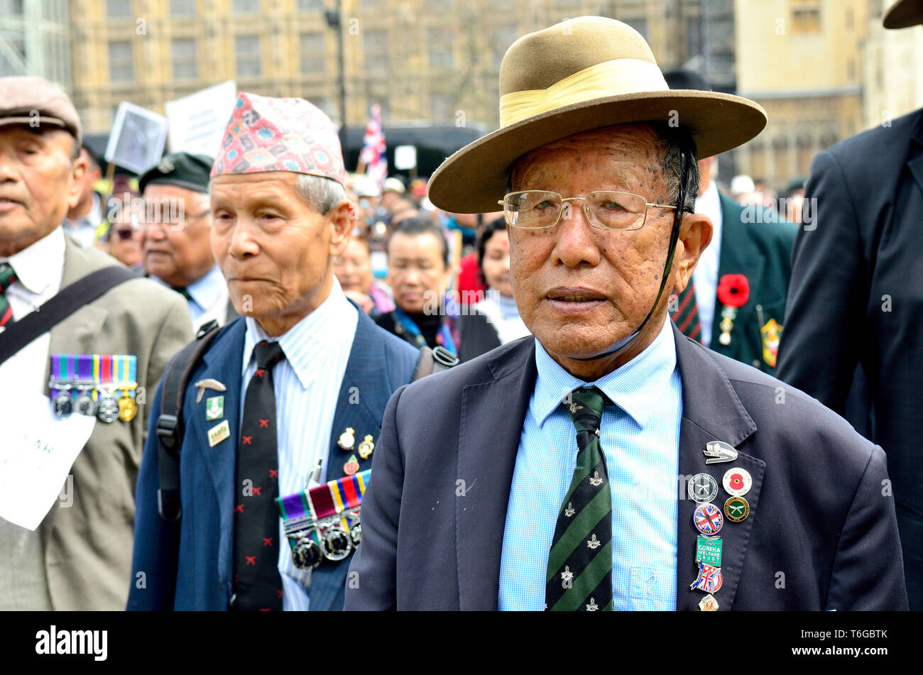 London, UK. 1st May 2019. Gurkha veterans march to Parliament Square demanding equal rights with British and Commonwealth soldiers Credit: PjrFoto/Alamy Live News Stock Photo