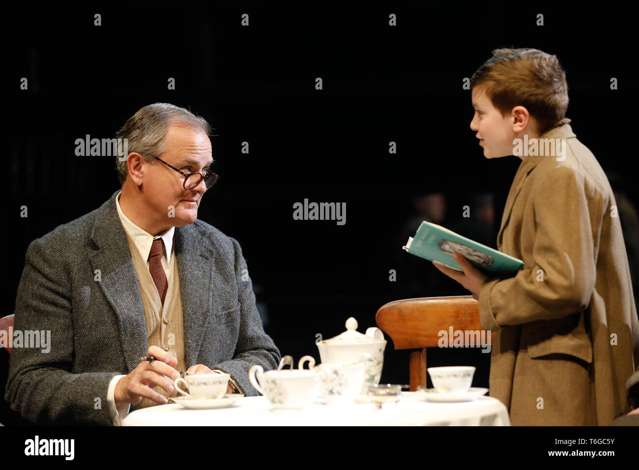 Chichester, UK. 1st May 2019. Hugh Bonneville (L) performs as C.S. Lewis, with Eddie Martin (as Douglas Gresham) during a photocall for William Nicholson's 'Shadowlands' at the Chichester Festival Theatre in West Sussex, UK Wednesday May, 1, 2019. The play, directed by Rachel Kavanaugh, runs until May 25. Photograph : Credit: Luke MacGregor/Alamy Live News Stock Photo