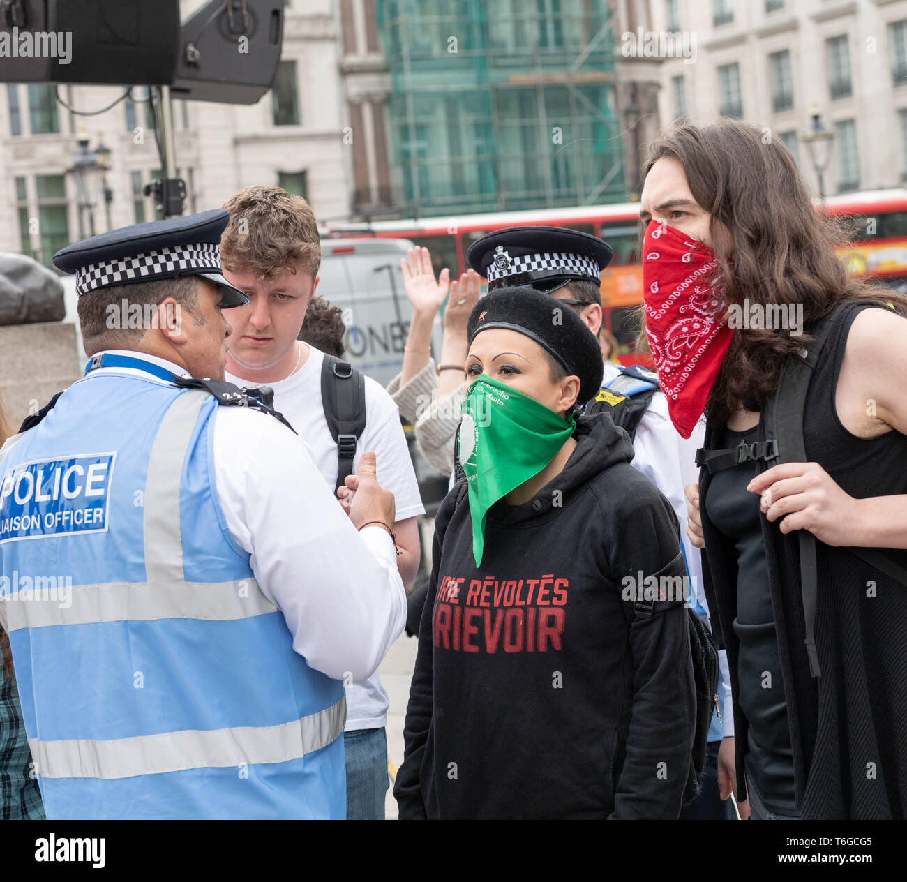 London, UK. 1st May 2019. May Day Labour rally and March with Trade Unions and international organsiations celebrating Labour Day in Trafalgar Square Police had to intervene in the arguments between pro and anti transgender rights protesters Credit: Ian Davidson/Alamy Live News Stock Photo