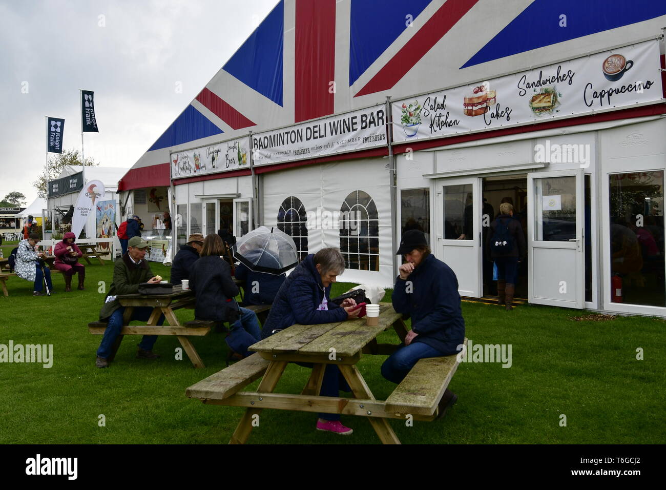 Badminton, Gloucestershire, UK. 1st May 2019. UK Weather: On a wet and damp afternoon visitors seen walking between trade stands at the 70th Anniversary of The Mitsubishi Motors Badminton Horse Trials.Picture Credit: Robert Timoney/Alamy Live News Stock Photo