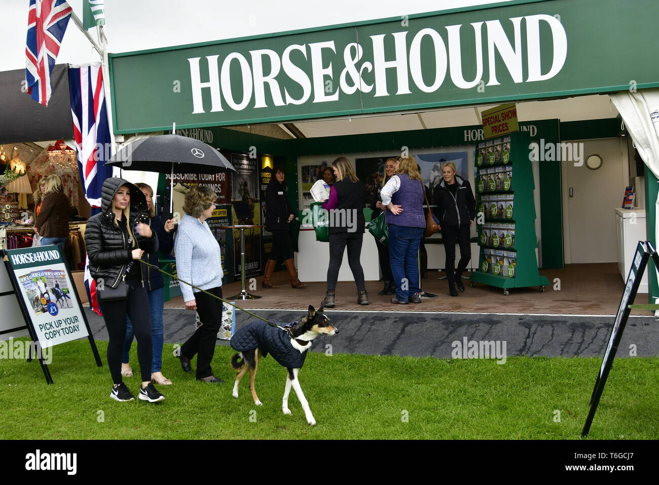 Badminton, Gloucestershire, UK. 1st May 2019. UK Weather: On a wet and damp afternoon visitors seen walking between trade stands at the 70th Anniversary of The Mitsubishi Motors Badminton Horse Trials.Picture Credit: Robert Timoney/Alamy Live News Stock Photo