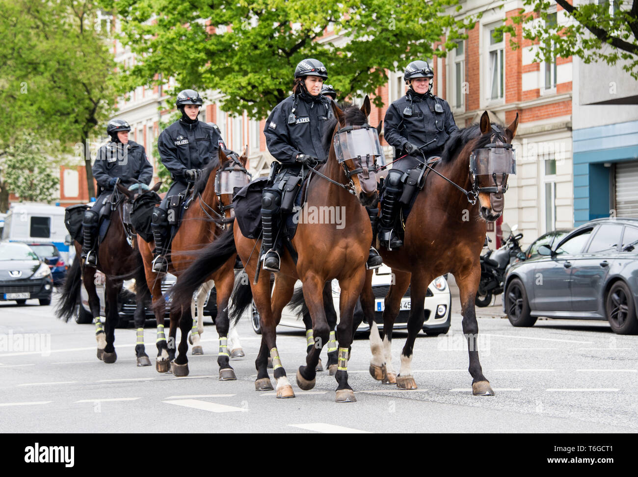 Hamburg, Germany. 01st May, 2019. Police officers on police horses ride in  front of the "Revolutionaries May 1 Demonstration" through the Altona  district. Credit: Daniel Bockwoldt/dpa/Alamy Live News Stock Photo - Alamy