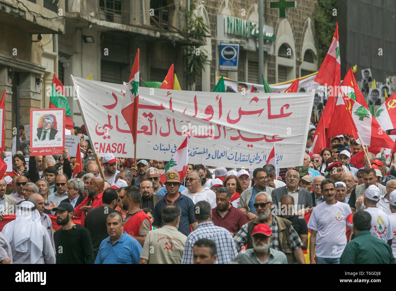 Beirut, Lebanon. 1st May, 2019. Supporters of the Lebanese Communist party march with Arabic banners in a May Day rally through central Beirut as they mark International Workers' Day Credit: amer ghazzal/Alamy Live News Stock Photo
