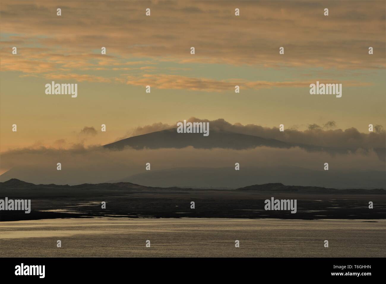 Barrow-In-Furness, Cumbria, UK. 1st May 2019. UK Weather. After a day of sunshine and showers from the Cumbrian Coast. View across Walney Channel towards Black Combe and the English Lake District. Credit : greenburn / Alamy Live News. Stock Photo