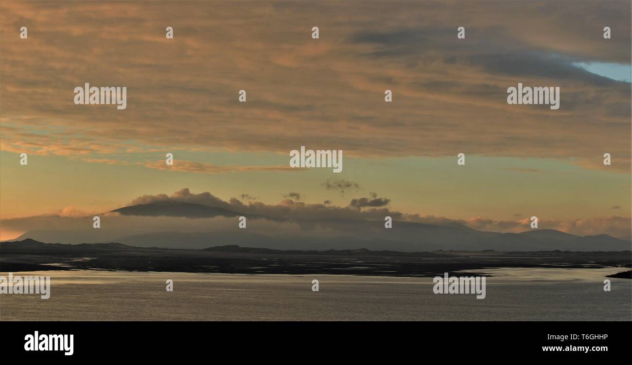 Barrow-In-Furness, Cumbria, UK. 1st May 2019. UK Weather. After a day of sunshine and showers from the Cumbrian Coast. View across Walney Channel towards Black Combe and the English Lake District. Credit : greenburn / Alamy Live News. Stock Photo