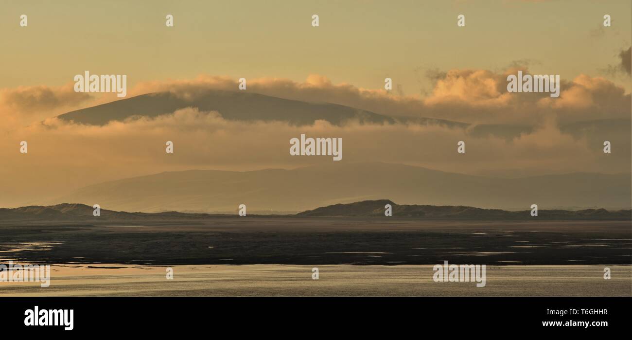 Barrow-In-Furness, Cumbria, UK. 1st May 2019. UK Weather. After a day of sunshine and showers from the Cumbrian Coast. View across Walney Channel towards Black Combe and the English Lake District. Credit : greenburn / Alamy Live News. Stock Photo