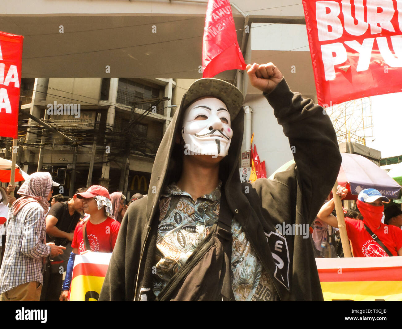 Manila, Philippines. 17th Jan, 2012. A protester wearing Guy Falkes mask seen taking part during the Labour Day Protest in Manila.Workers took to the streets from Welcome Rotonda in Quezon City to Mendiola in Manila on Labour Day demanding for wage hikes, Implementation of the Expanded Maternity Leave Act, Junking of the Tax Reform for Acceleration and Inclusion Law. They also asked for an end of Contractualization on employees and workers. Credit: Josefiel Rivera/SOPA Images/ZUMA Wire/17�Թ����� Live News Stock Photo
