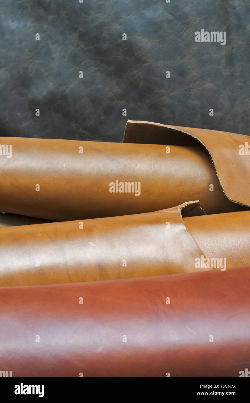 Closeup of various colors natural cow leather fabric rolls Stock Photo
