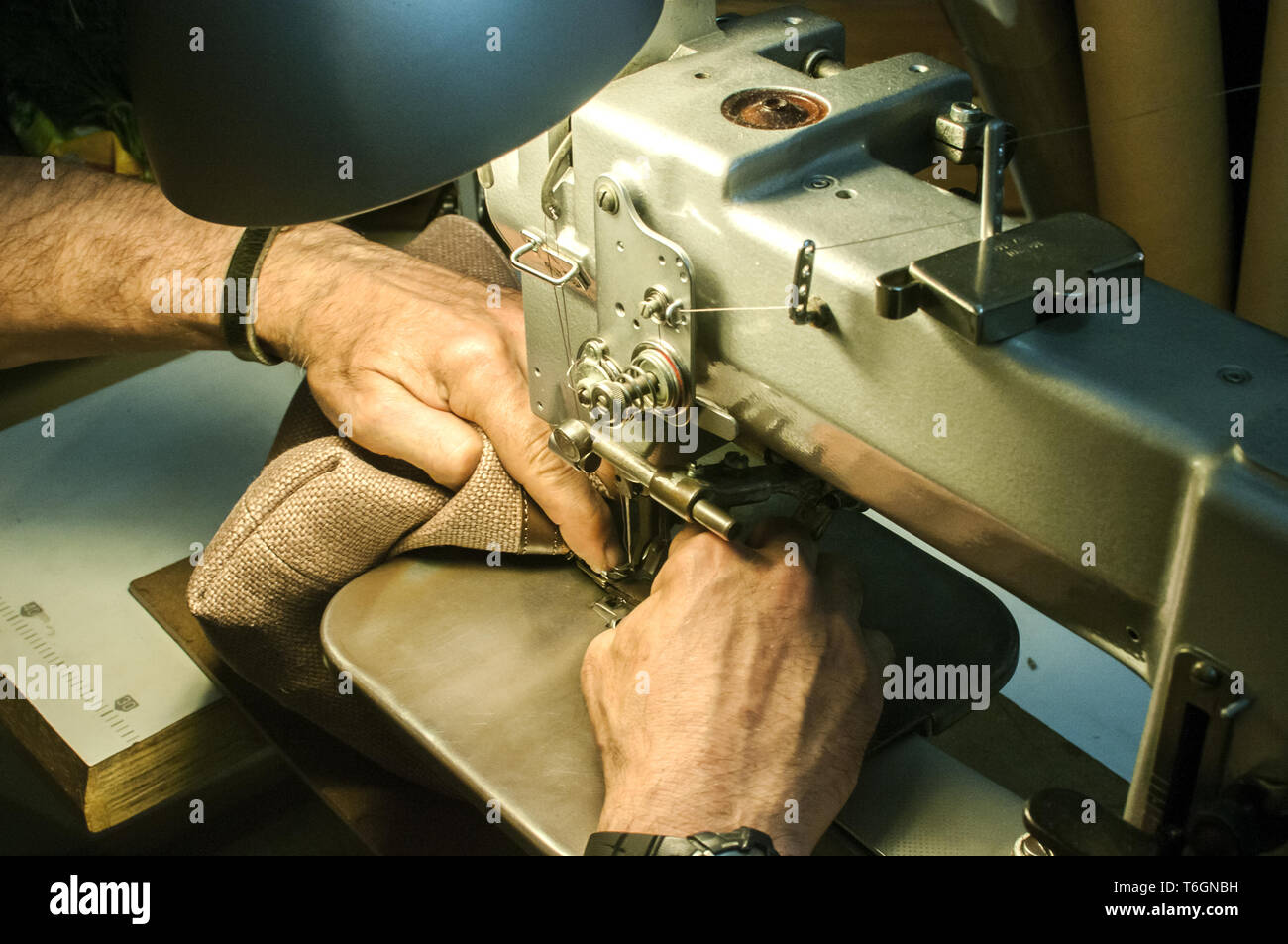 Hands of leather tailor Stock Photo