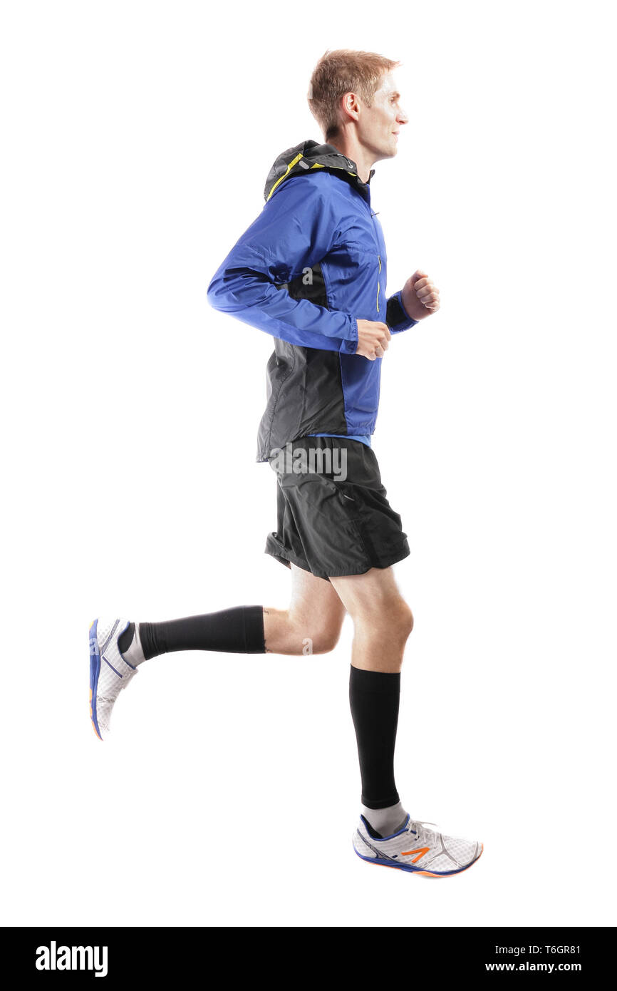Young attractive athlete running and showing perfect running technique Stock Photo