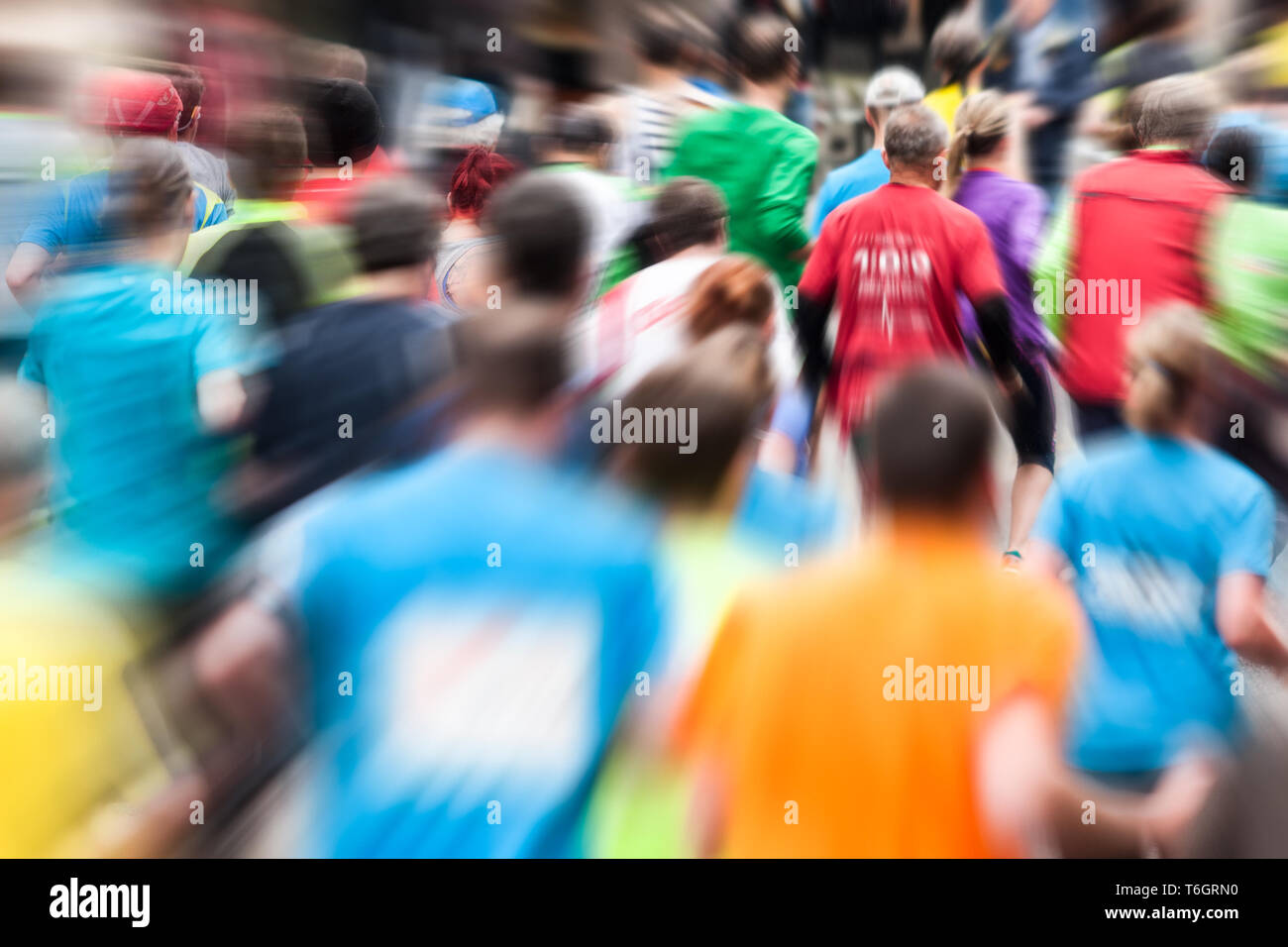 Different runners at the marathon from behind Stock Photo