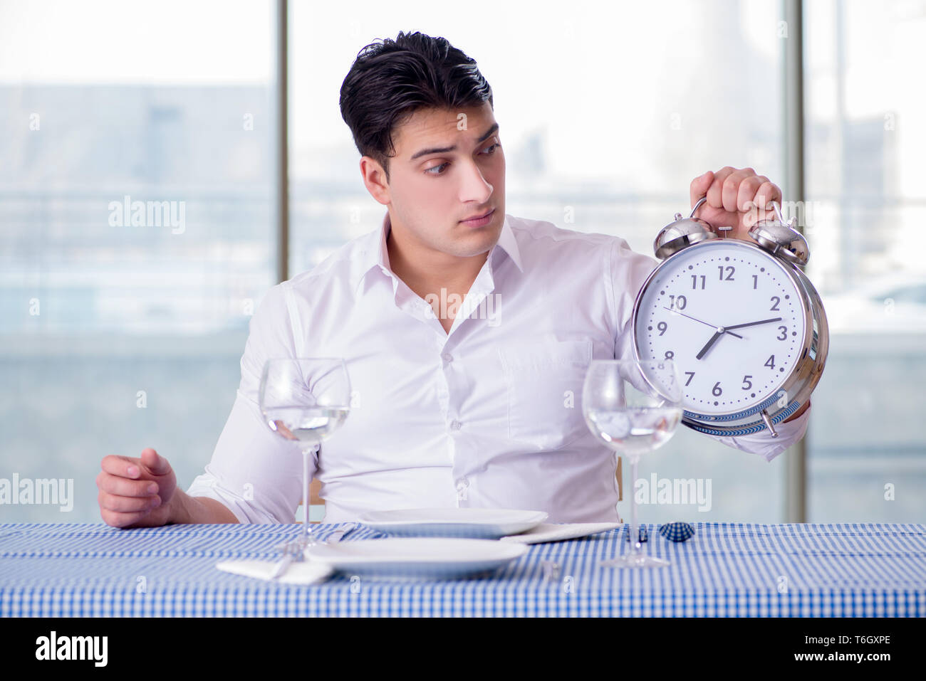 Sad man dining alone hi-res stock photography and images - Alamy