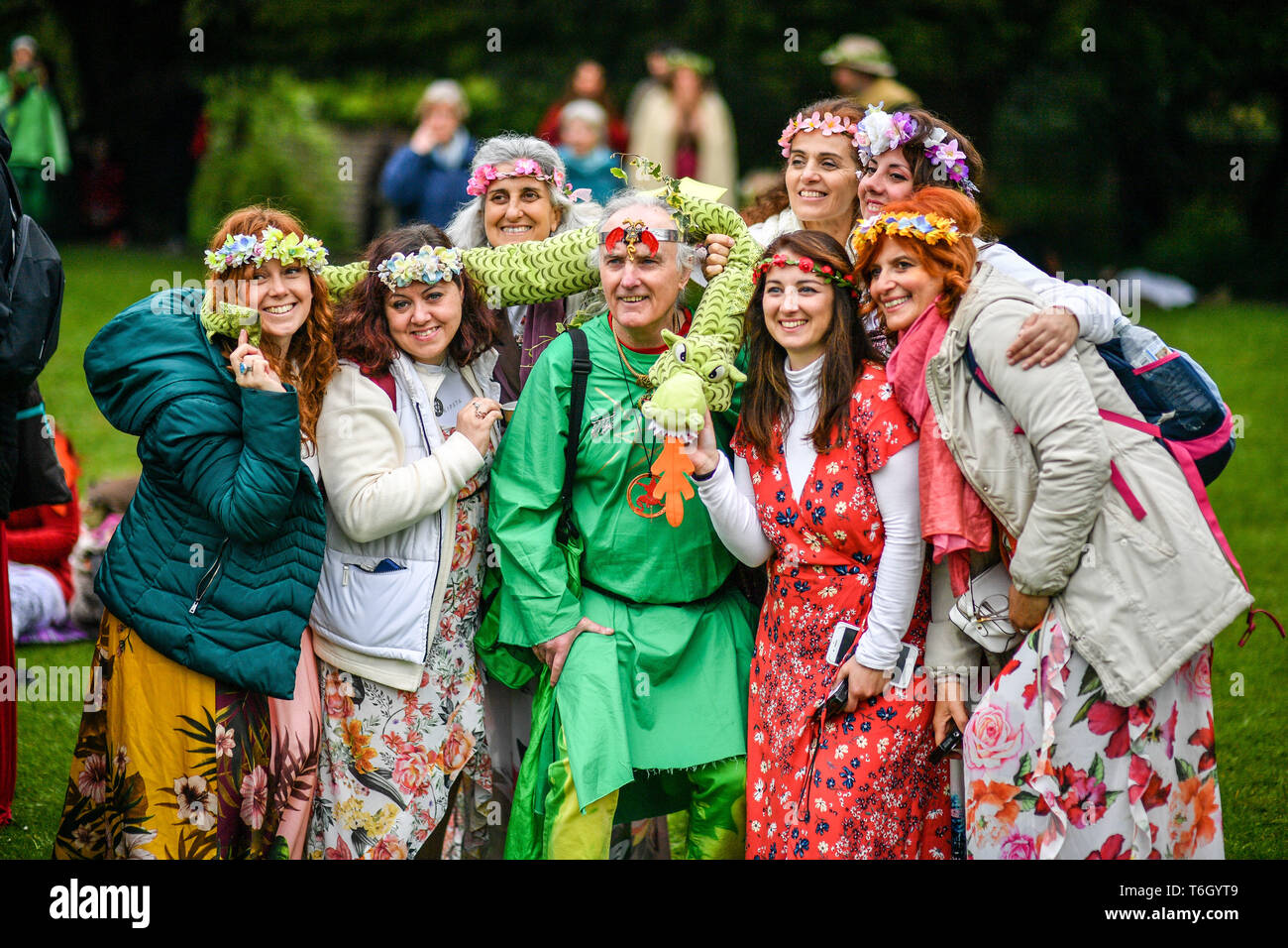 People Pose For A Picture During The Beltane Celebrations At Glastonbury Chalice Well Where People Gather To Observe A Modern Interpretation Of The Ancient Celtic Pagan Fertility Rite Of Spring Stock Photo