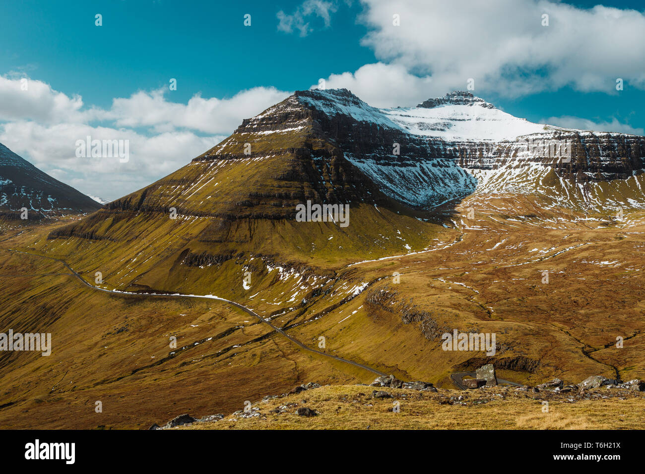 View of the snow-covered peak of Slættaratindur, the highest mountain on the Faroe Islands during a sunny spring day (Faroe Islands, Denmark, Europe) Stock Photo