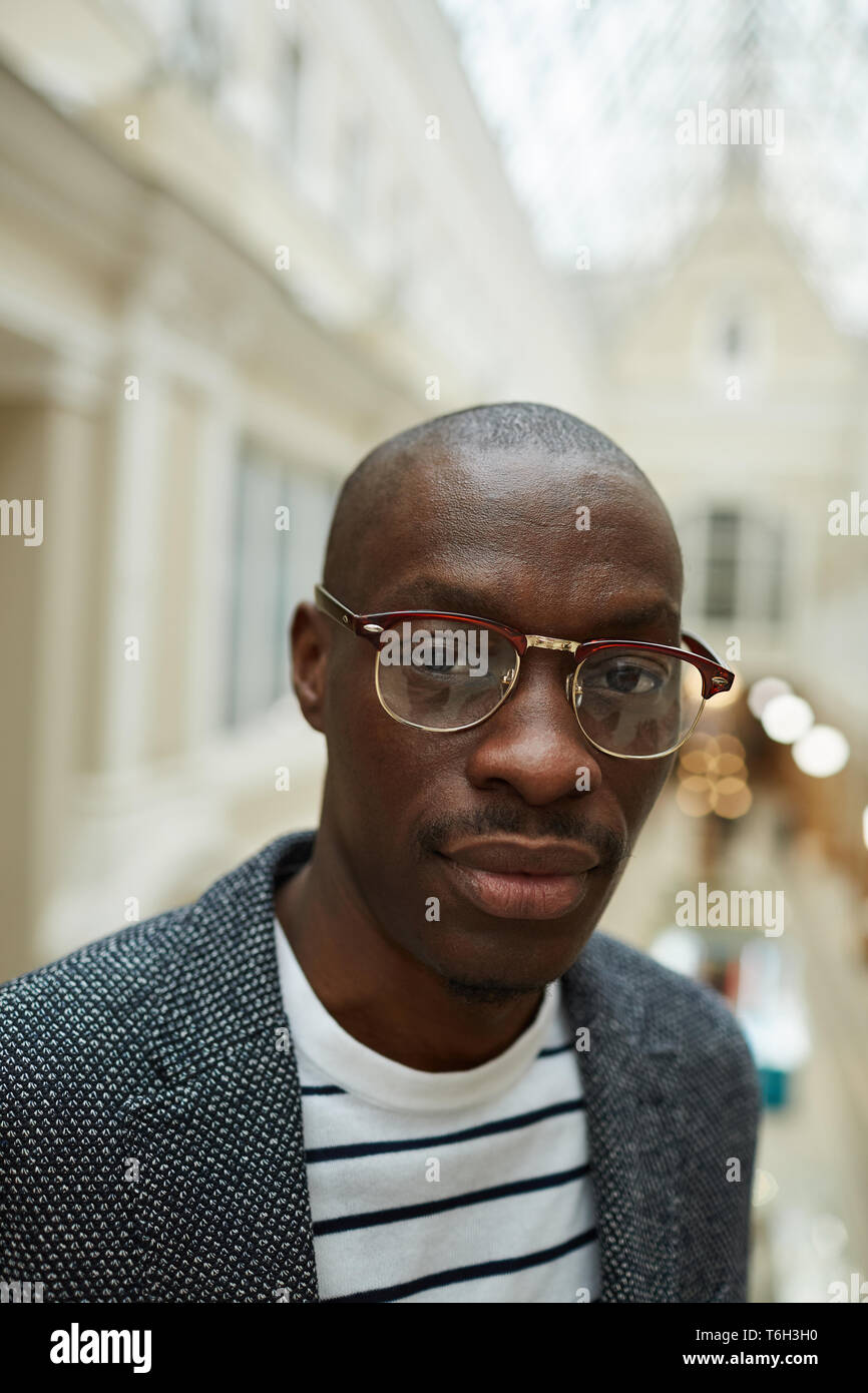 Man young glasses bald head hi res stock photography and images Alamy