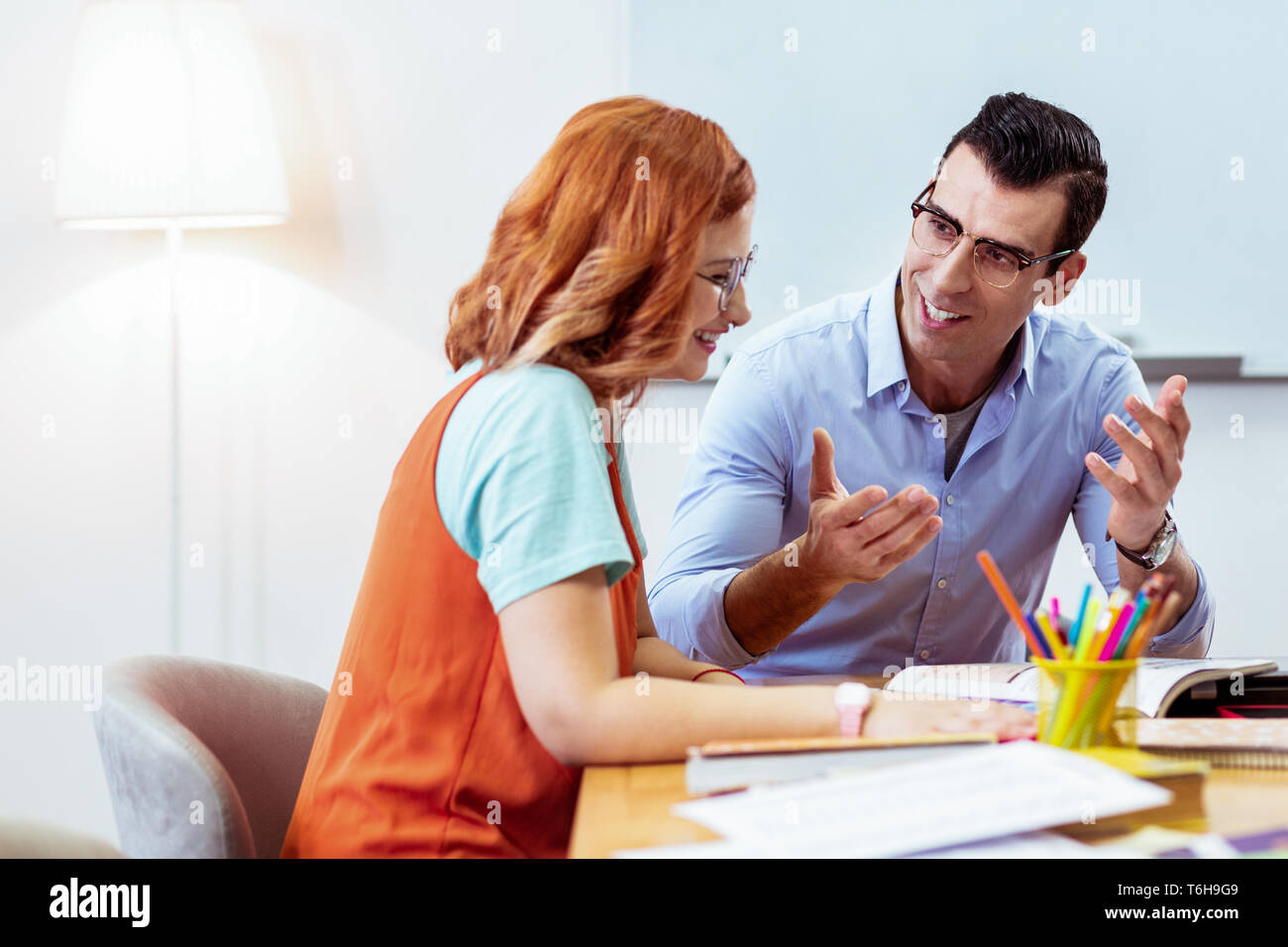 Positive joyful people discussing their new project Stock Photo