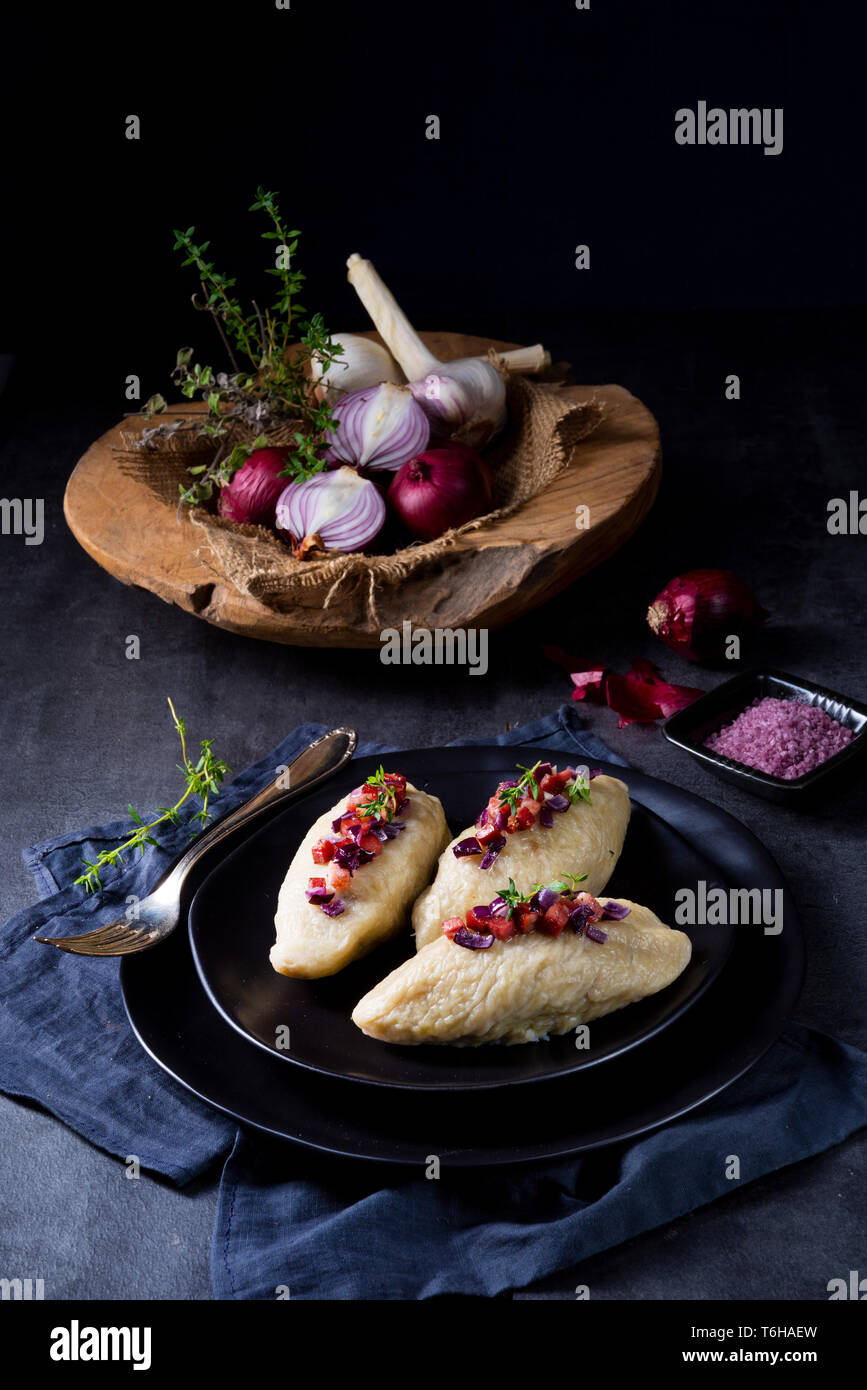 Rustic Cepelinai, a specialty Lithuanian and Polish cuisine. Stock Photo