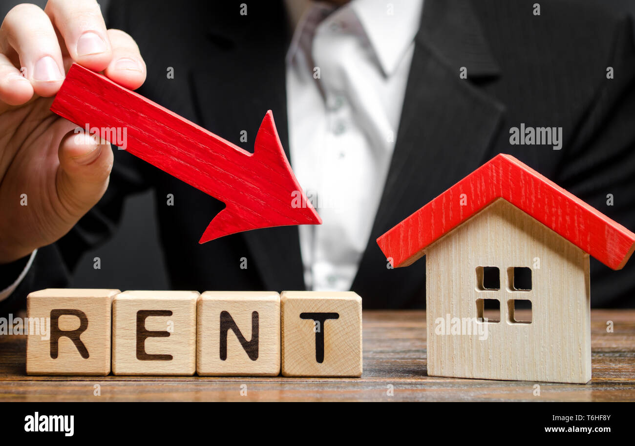 Blocks with the word Rent, down arrow and a miniature house. The concept of reducing the price