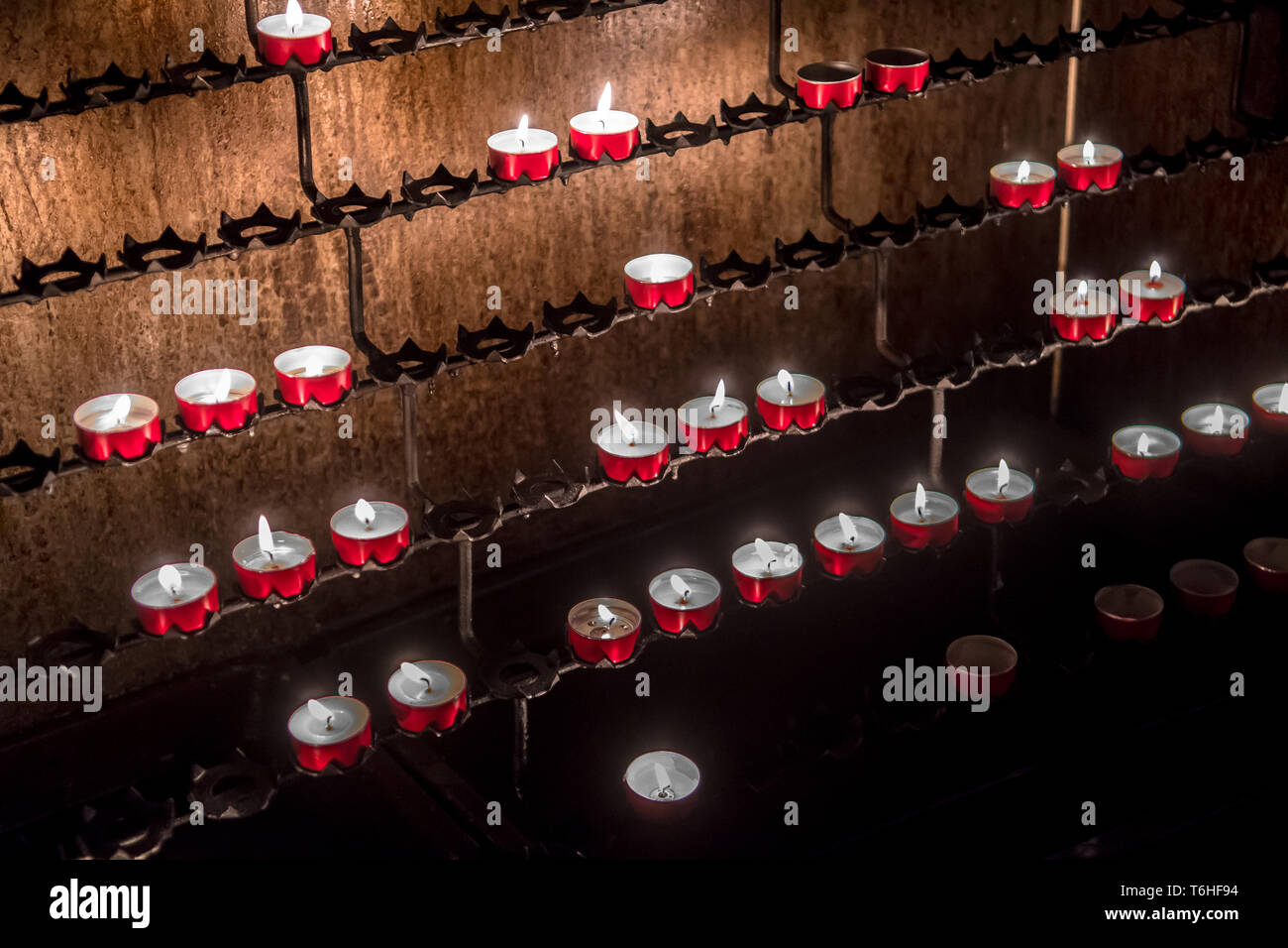 Red Memory Candles Burning In Chapel Stock Photo