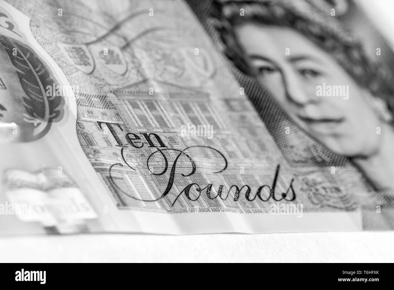 Close-up, macro photo of a piece of £10 banknote. Ten pounds sterling. Portrait of Queen Elizabeth II Stock Photo