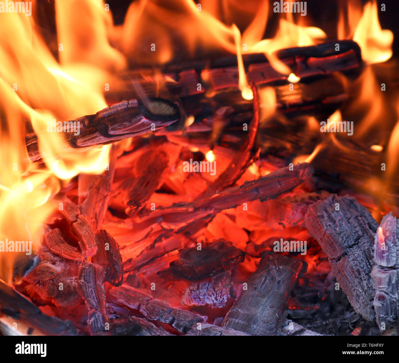 Bright flame of fire. Fire and embers. Selective focus. Texture closeup background Stock Photo