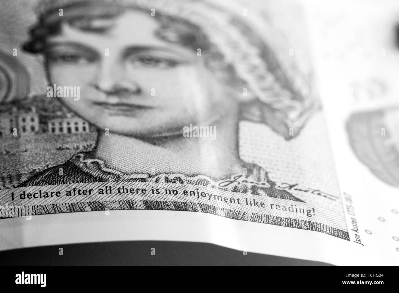 Close-up, macro photo of £10. Ten pounds sterling. Jane Austen quote: 'I declare after all there is no enjoyment like reading!' Stock Photo