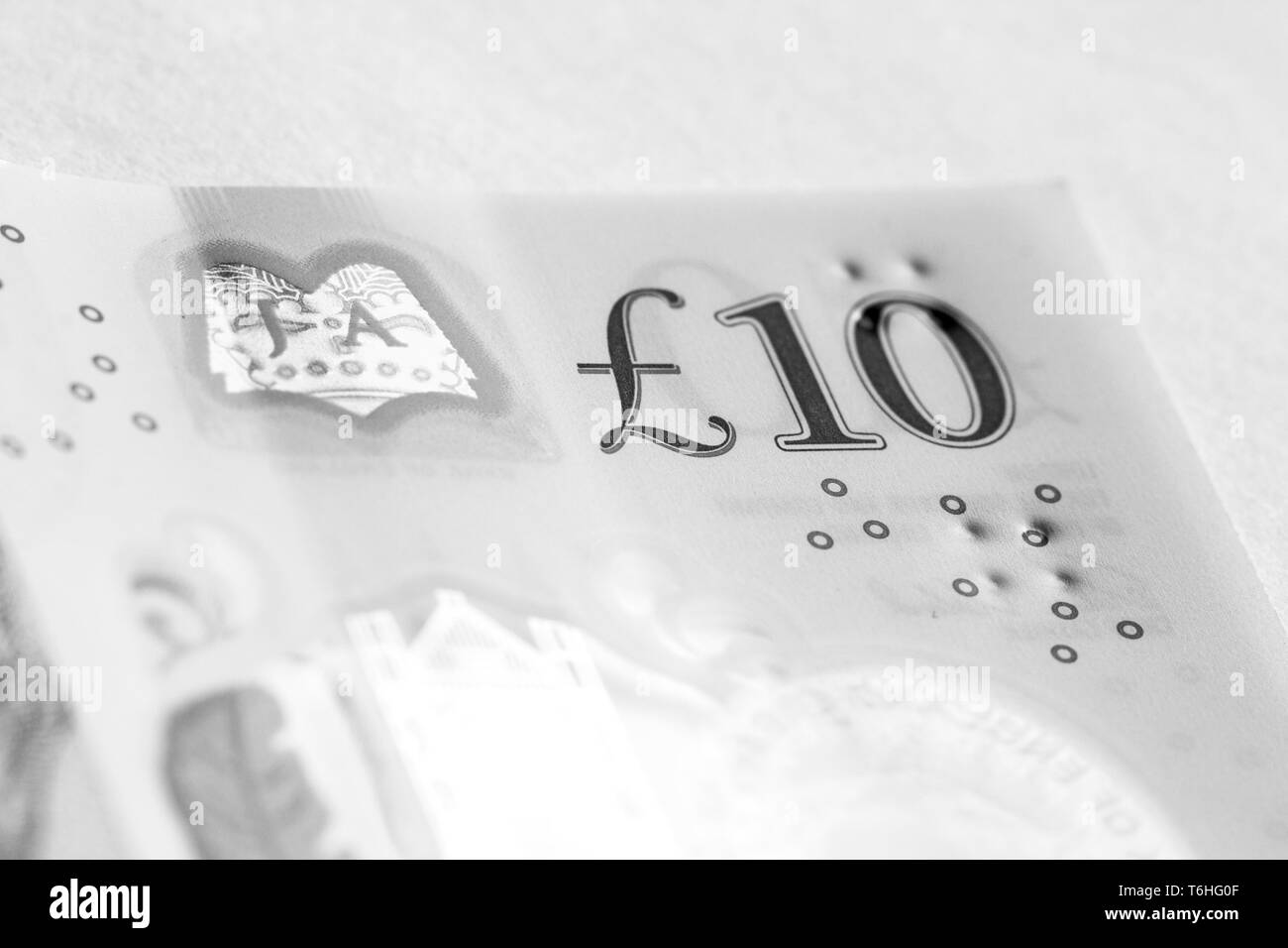 Close-up, macro photo of piece of £10 banknote. Ten pounds sterling. Stock Photo
