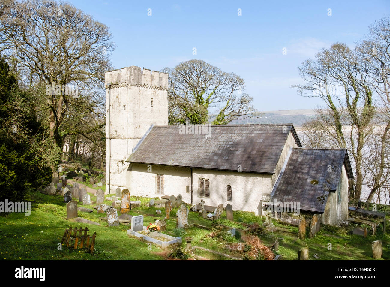 Small rural 14th century Norman church of St Illtyd with battlemented tower on Gower Peninsula, Oxwich, West Glamorgan, South Wales, UK, Britain Stock Photo