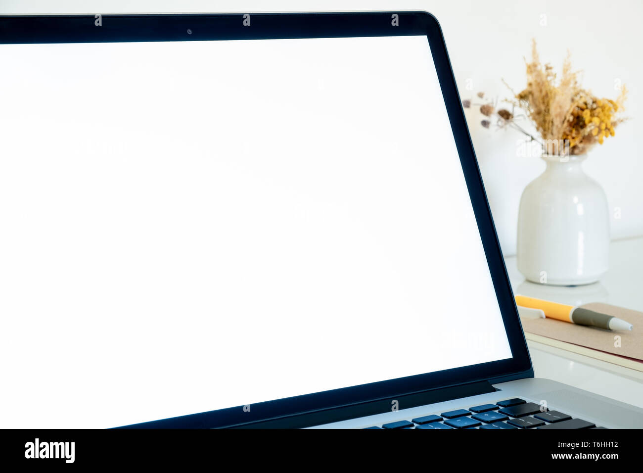 White screen of a laptop, closeup copy space view. Portable computer