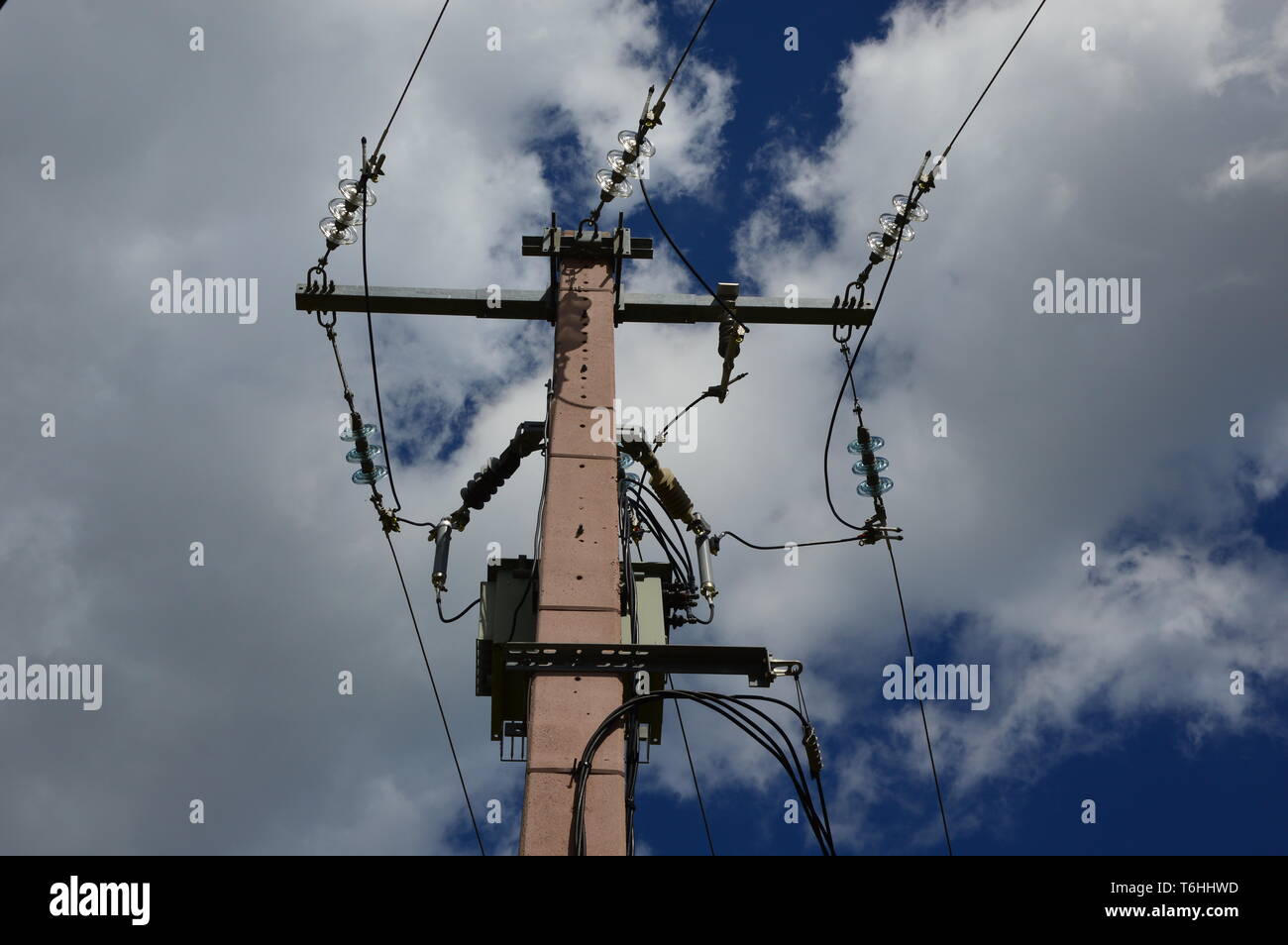 A current transformer on a power pole Stock Photo