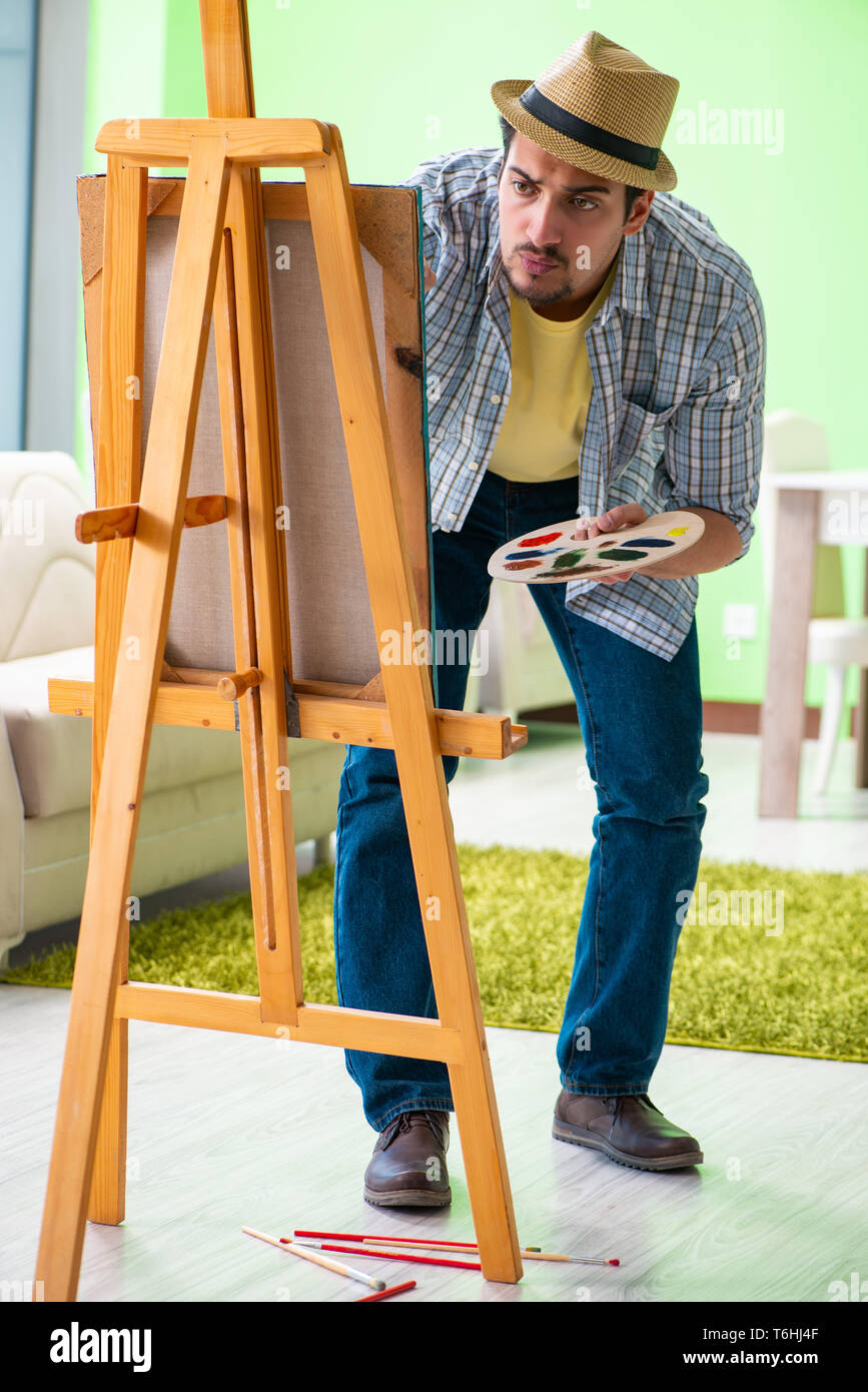 Artist thinking painting on canvas hi-res stock photography and images ...