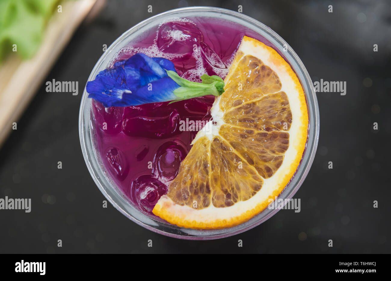 Ice cold sweet berry fruit drink  with outdoor sunset lighting. Stock Photo