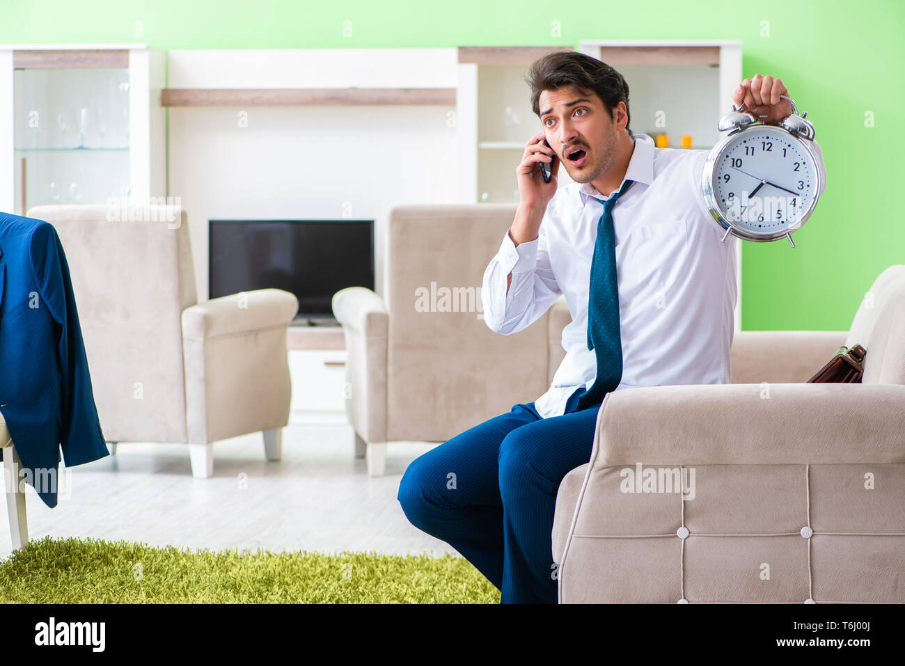 Man dressing up and late for work Stock Photo Alamy