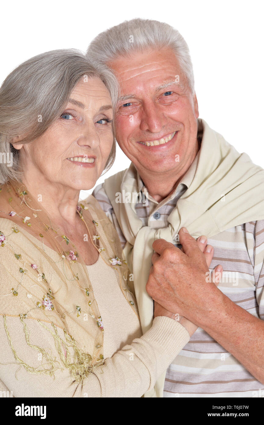 Portrait of happy senior couple holding hands Stock Photo