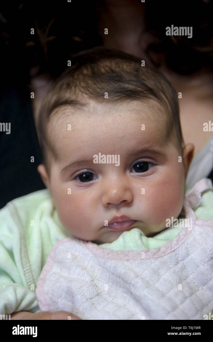Portrait of a cute little baby girl looking the camera Stock Photo - Alamy