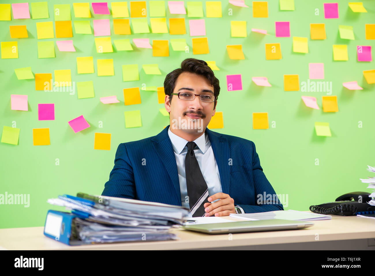 Businessman having trouble with his priorities Stock Photo