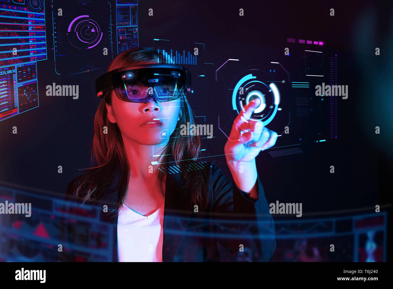 Business woman try vr glasses hololens in the dark room | Portrait of young asian girl experience ar communication | Future technology concept Stock Photo