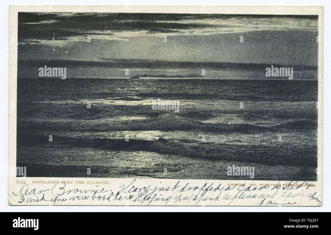 Detroit Publishing Company vintage postcard of Moonlight over the Atlantic Ocean with tall ship visible, 1900. From the New York Public Library. () Stock Photo